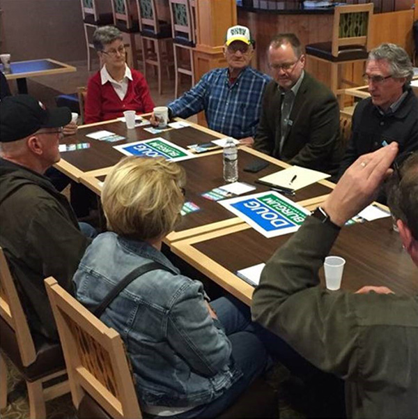 Leif Hemstad's parents at a town hall meeting with Governor Doug Burgum